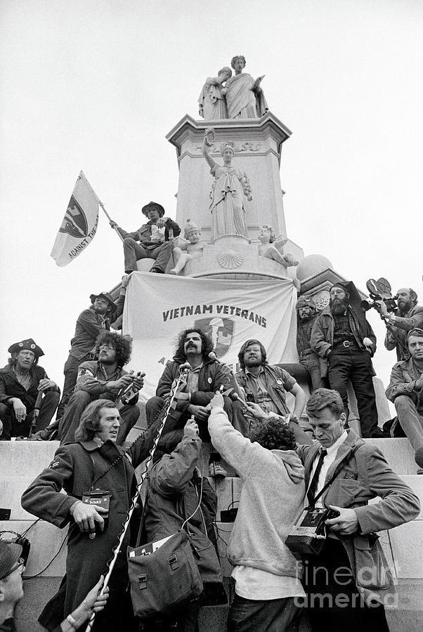 War Protesters Standing In Front Photograph by Bettmann