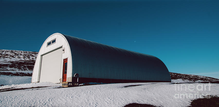 Warehouse road maintenance material on top of a snowy mountain. Photograph by Joaquin Corbalan