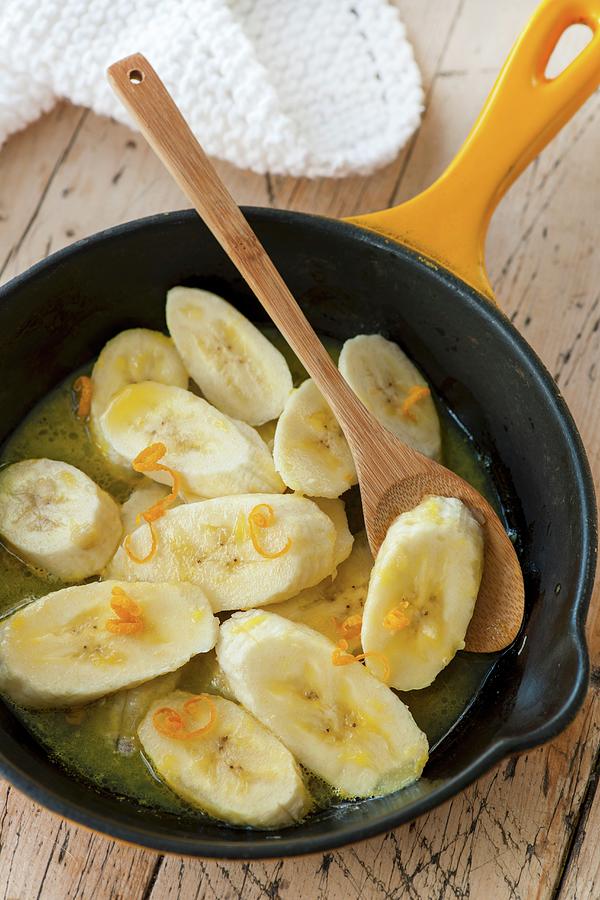 Warm Bananas Slices With Orange Syrup Photograph by Jonathan Short