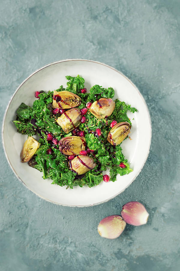 Warm Roasted Kale Salad With Baby Artichokes And Balsamic Pomegranate Cream vegan Photograph by Jan Wischnewski