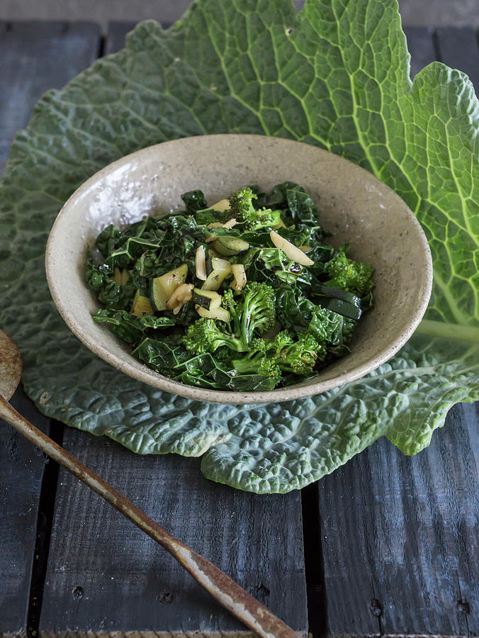 Warm Savoy Cabbage-zucchini-broccoli Salad With Balsamic Vinegar Photograph by Martina Schindler