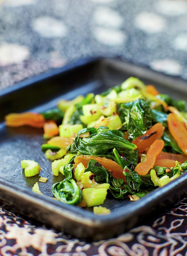 Warm Spinach Salad With Dried Apricots Photograph by Lars Ranek
