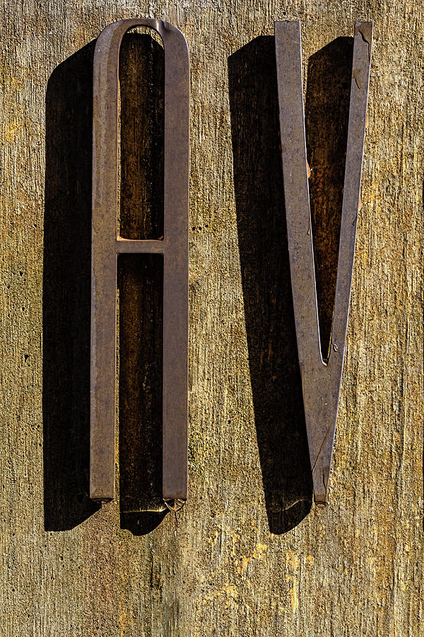 Water Drop on Raised Letter - Exterior sign Photograph by Robert Ullmann