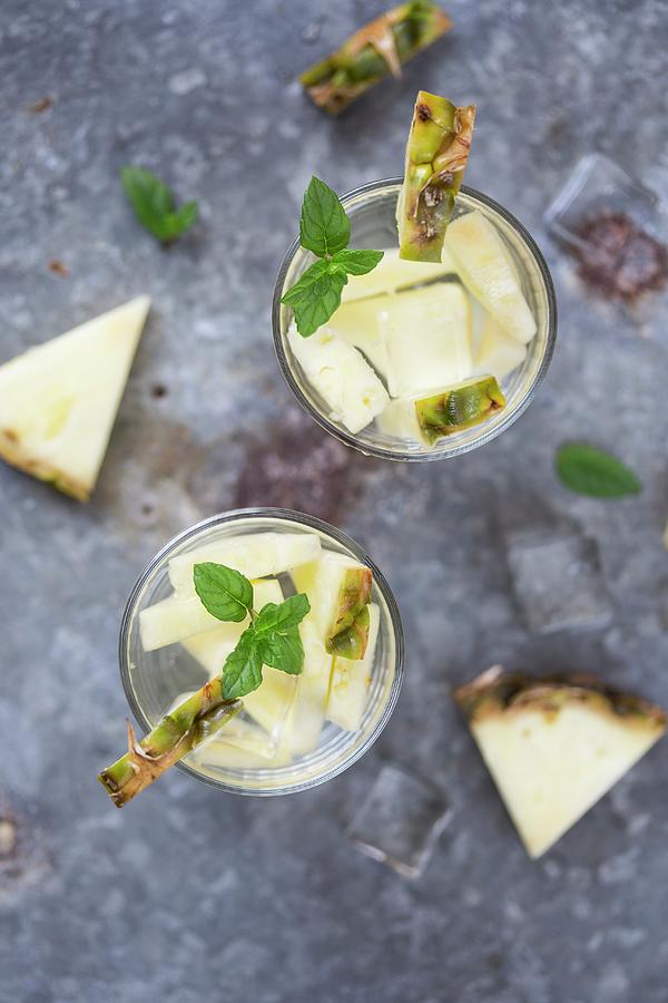 Water Flavoured With Pineapple And Mint Photograph by Malgorzata Laniak