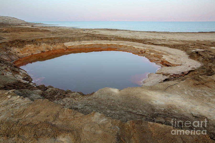 Water pools in a sink hole a8 Photograph by Nahum Budin