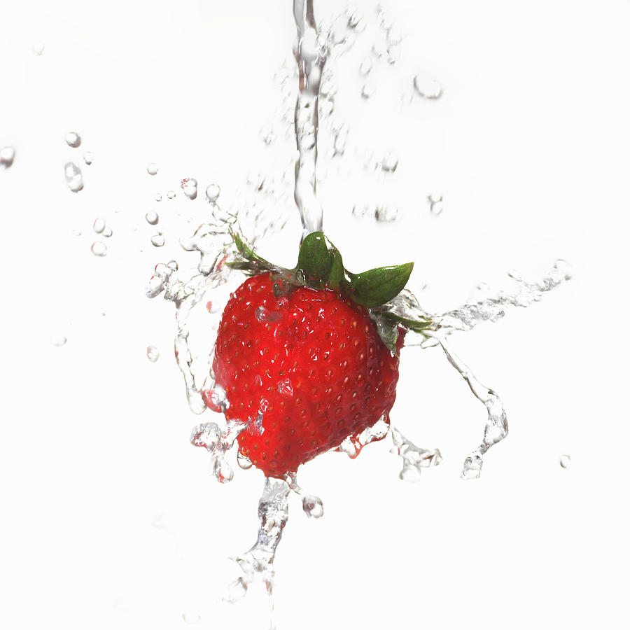 Water Splashing On Strawberry Photograph by Annabelle Breakey