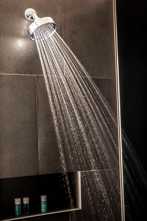 Water Spraying Out Of A Shower Head Photograph by Joseph De Sciose