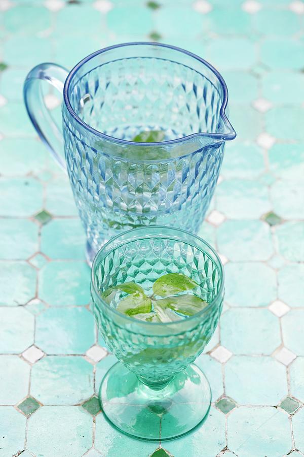 Water With Mint In A Blue Glass Carafe And A Drinking Glass Photograph by Petr Gross