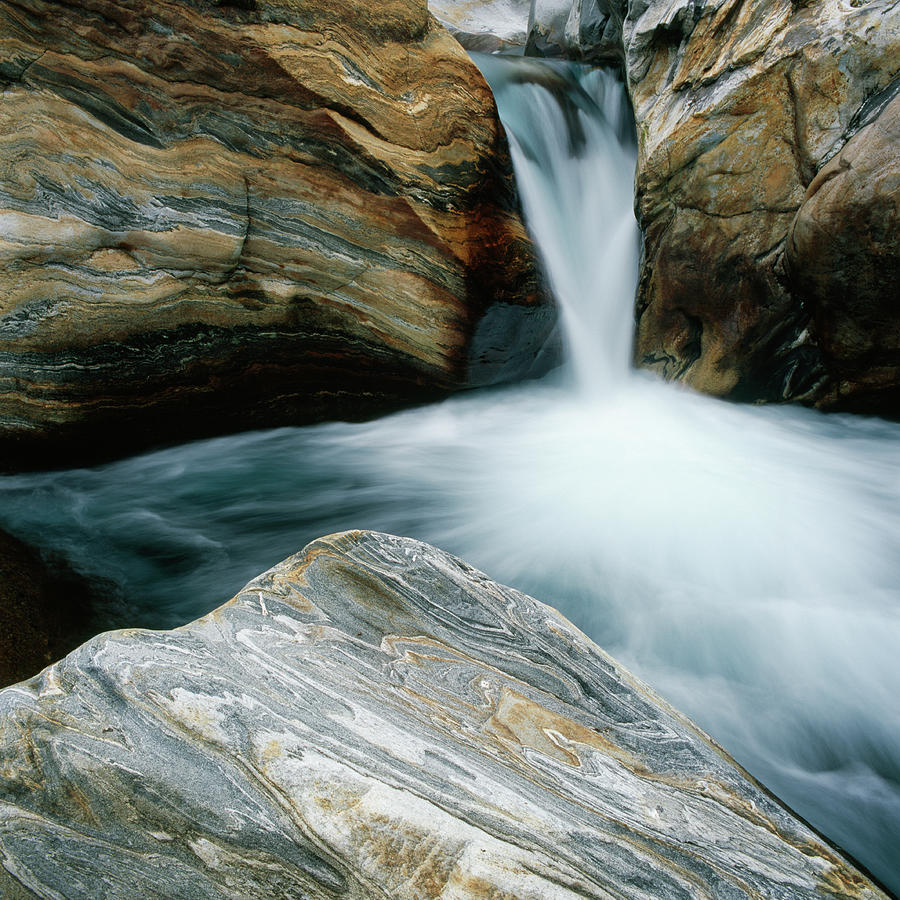 Waterfall Between Colorful Rocks Photograph by Micha Pawlitzki