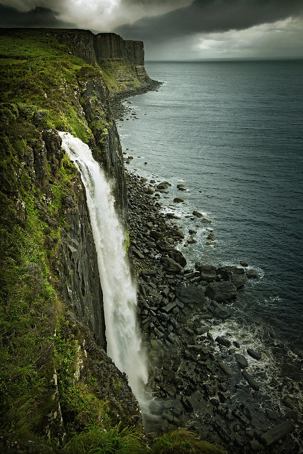 Waterfall Over Rocky Cliff And Sea Photograph by Chris Clor