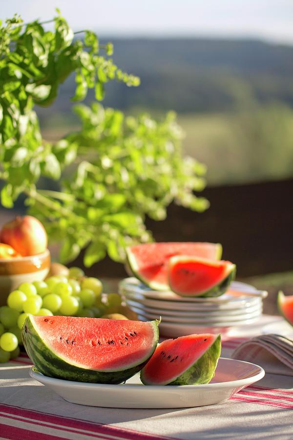 Watermelon On Table Set For Summer Picnic Photograph by Angela Francisca Endress