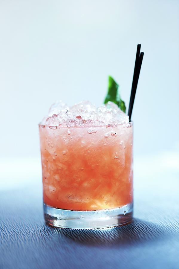 Watermelon Scotch Cocktail With Honey, Salt And Fresh Basil Photograph by Rannells, Greg