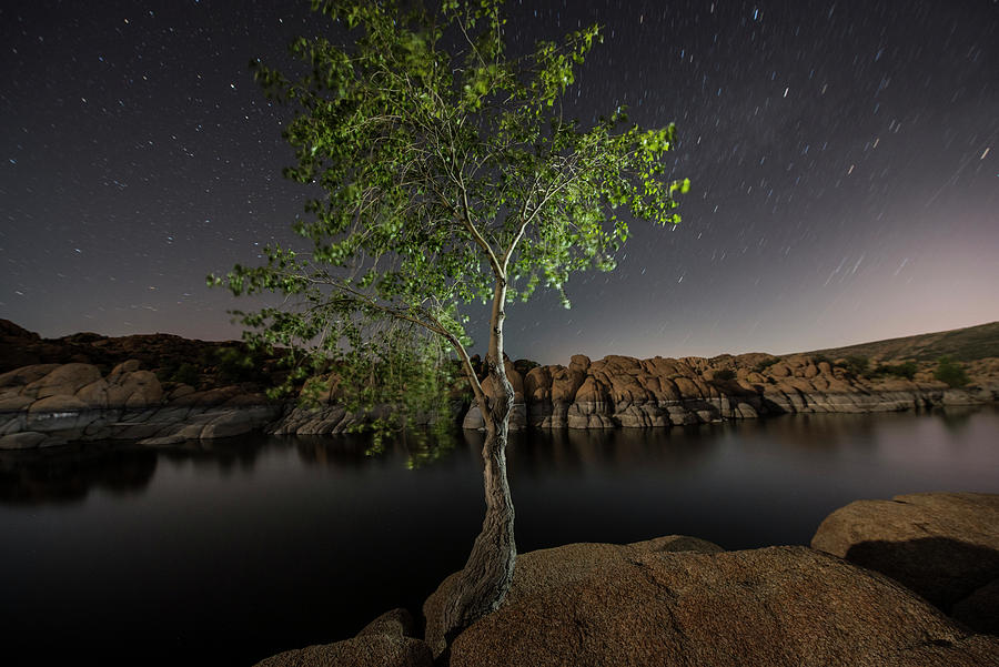 Watson Lake By Rock Formations Against Star Field Photograph by Cavan Images