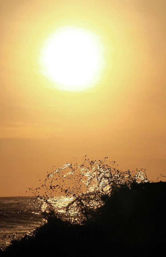 Wave Crashes Against Sunrise Photograph by Imaginegolf