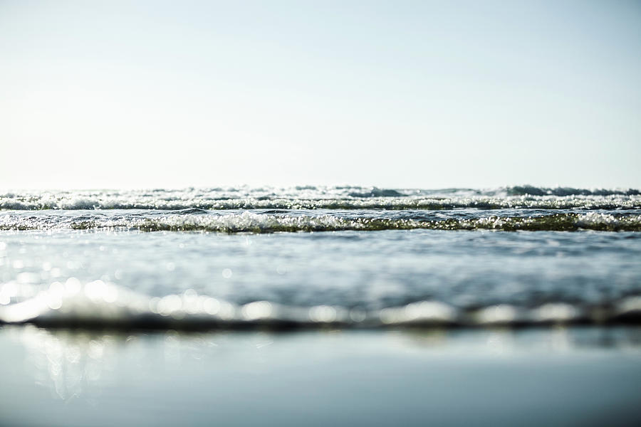Tranquility Photograph - Waves Washing Into A Beach by Steven Errico