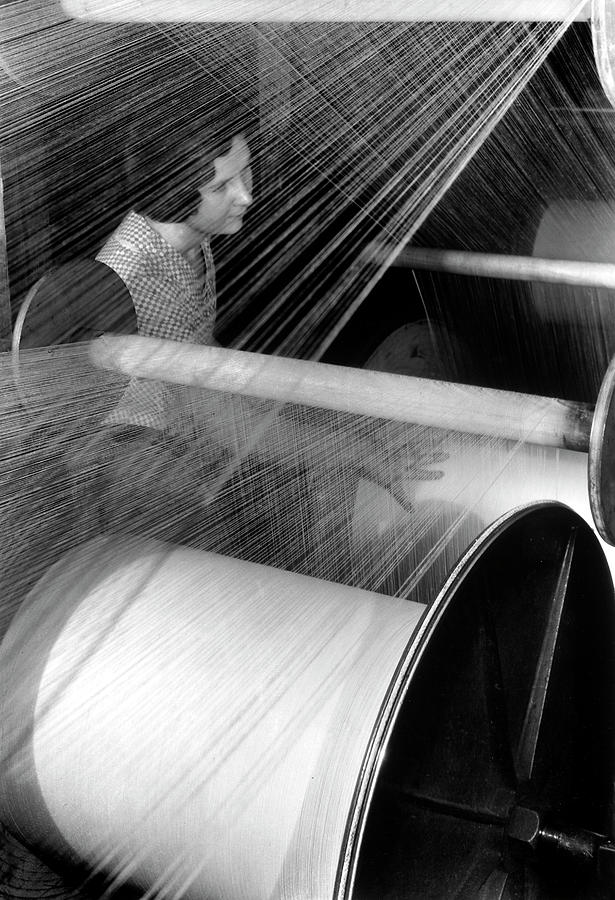 Black And White Photograph - Weaver at American Woolen Company. by Margaret Bourke-white