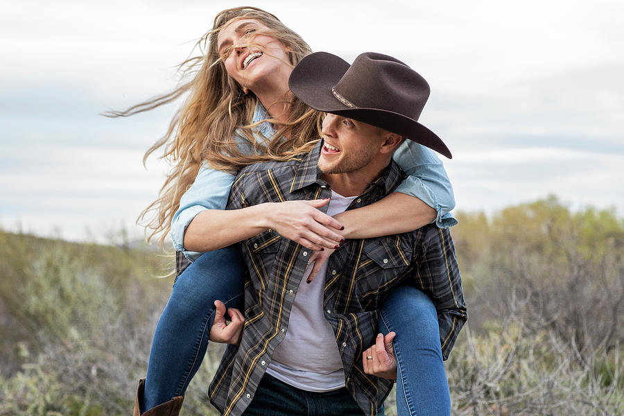 Cowboy woman orange dress dance hold dress Stock Photo by ©alanpoulson  38933545