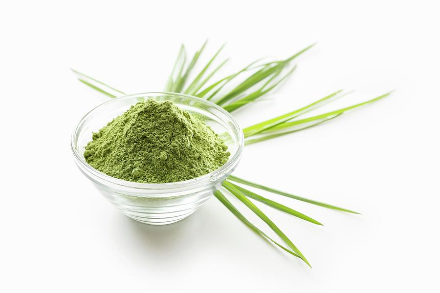 Wheatgrass Powder In A Glass Bowl On A White Surface Photograph by Petr Gross