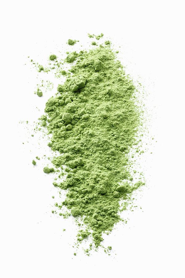 Wheatgrass Powder On A White Surface Photograph by Petr Gross