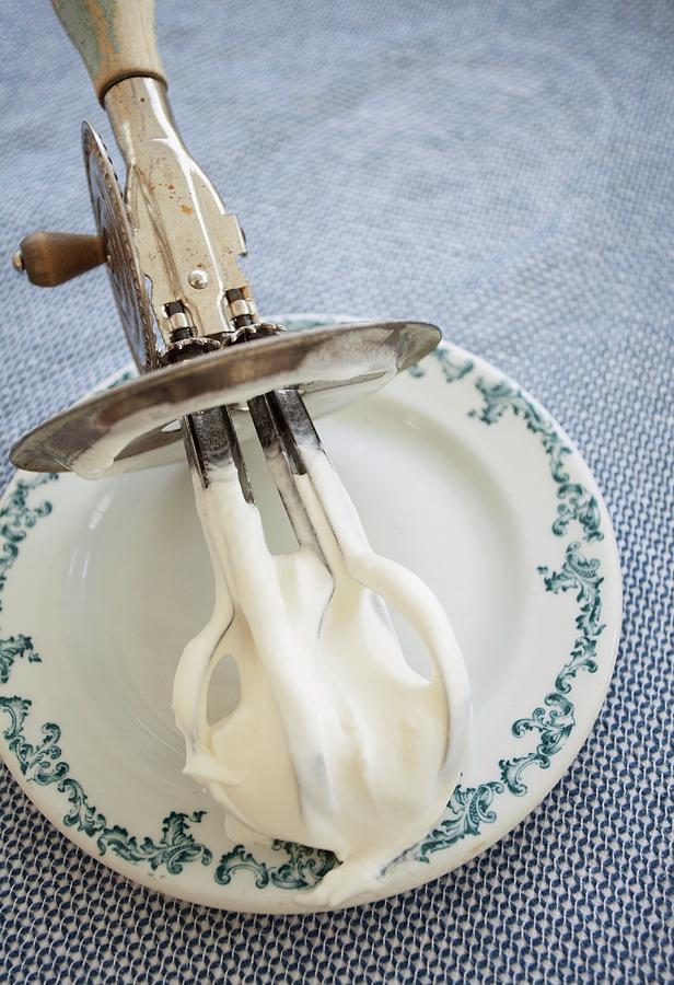 Whipped Cream On An Old Hand Mixer On A Plate Photograph by Ryla Campbell