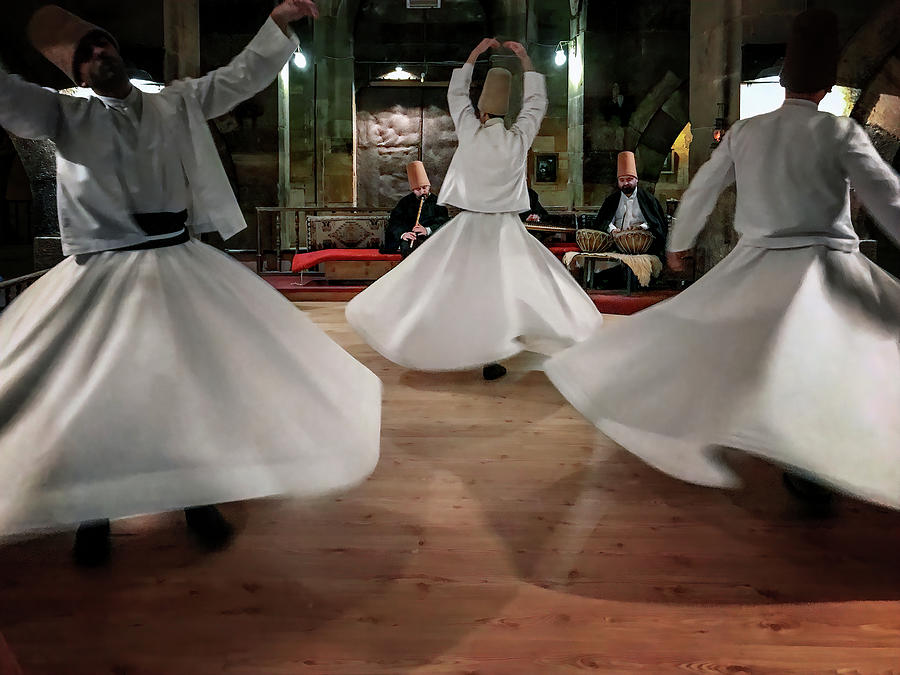 Whirling Dervishes  Photograph by Maria Coulson