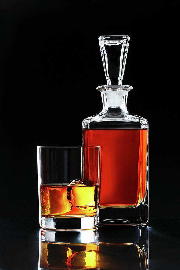 Whiskey In A Glass And In A Carafe Photograph by Perry Jackson