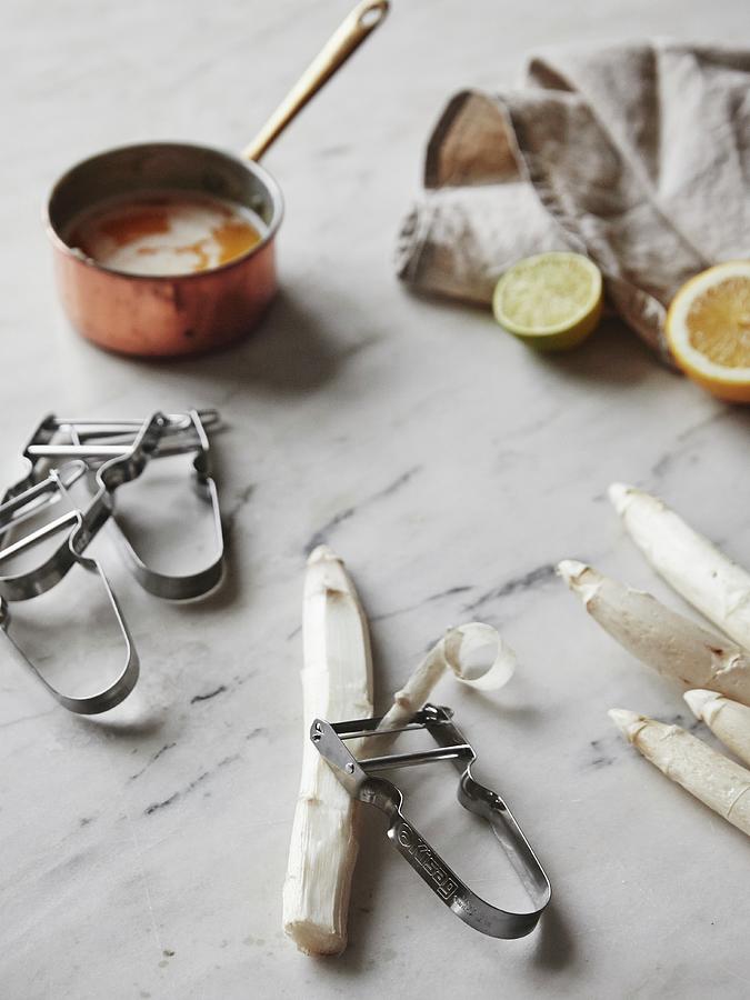 White Asparagus With A Peeler And A Saucepan Of Brown Butter Photograph by Fanny Rdvik