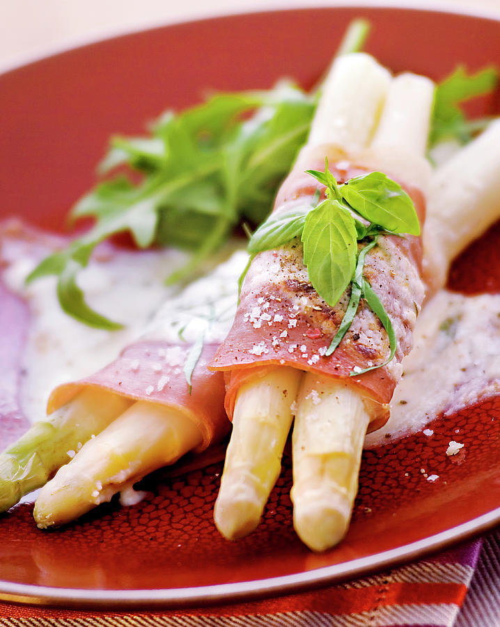 White Asparagus Wrapped In Bacon And Grilled With Parmesan Photograph by Nicolas Edwige