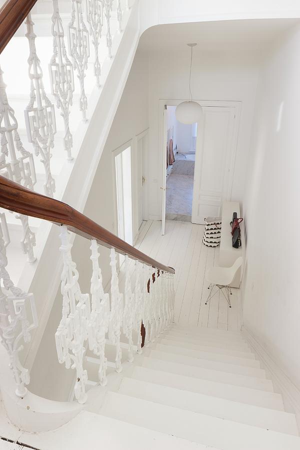 White Balustrade In Stairwell Leading Down Into White Hallway Of Period Apartment Photograph by Liesbet Goetschalckx