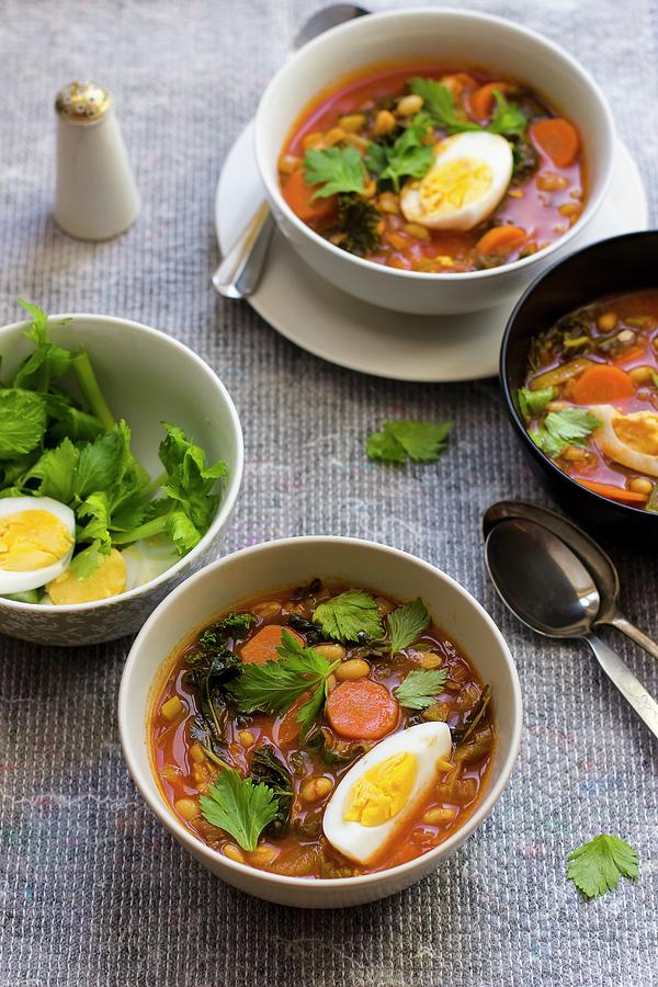 White Bean Soup With Harissa, Honey, Egg And Celery Leaves Photograph by Zuzanna Ploch