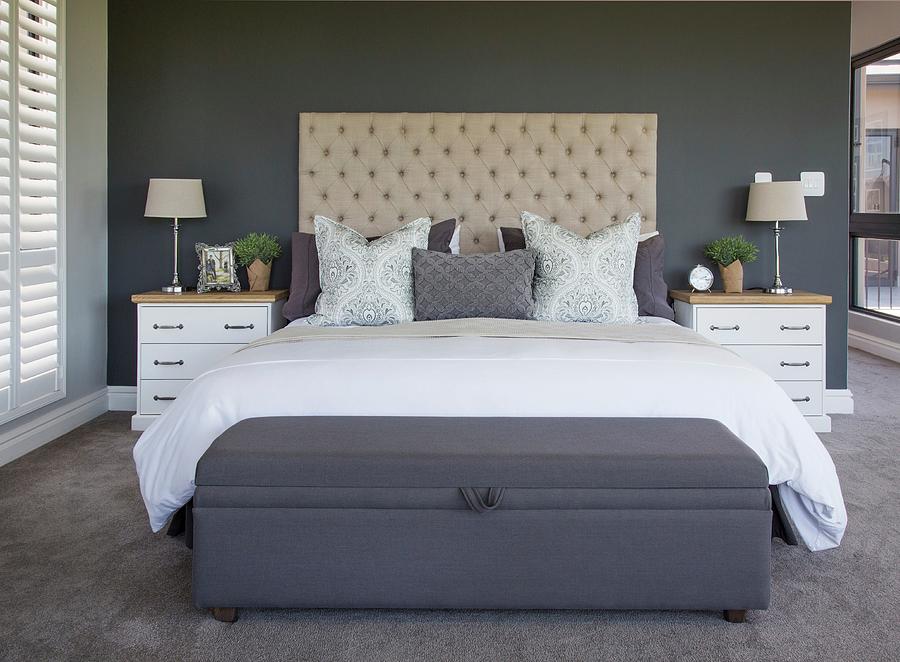 White Bedside Cabinets And Button-tufted Headboard In Bedroom Photograph by Great Stock!