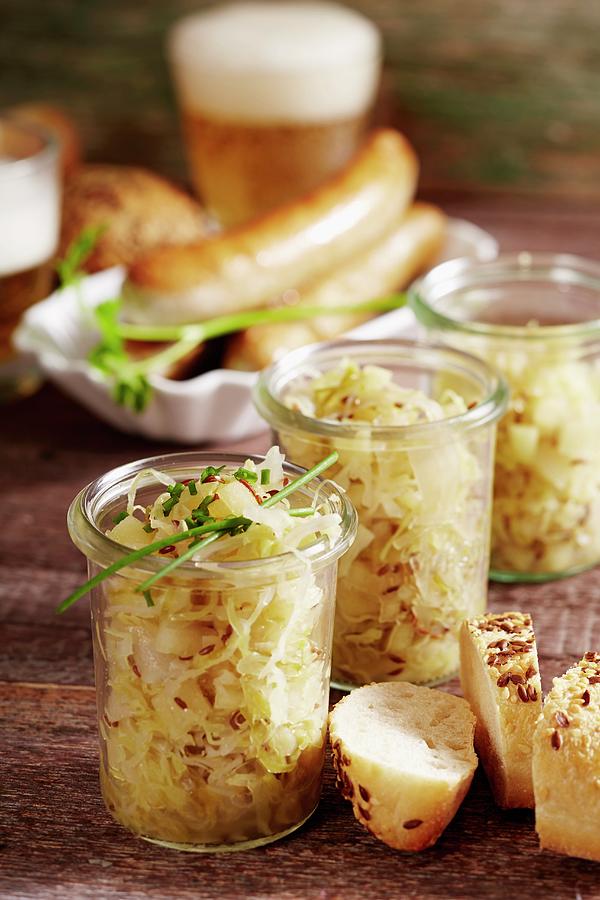 White Cabbage With Apples As A Side Dish With Sausage And Beer Photograph by Teubner Foodfoto