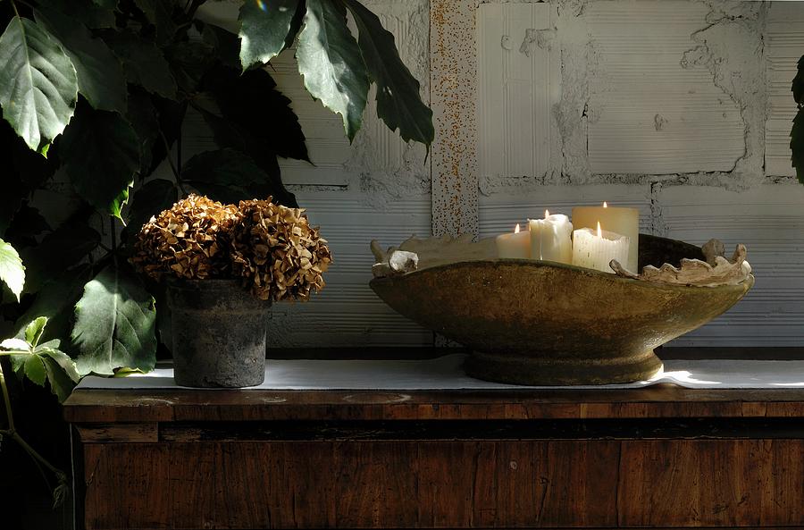 White Candles In Vintage Bowl And Pot Of Dried Flowers Photograph by Olimpia Lalli