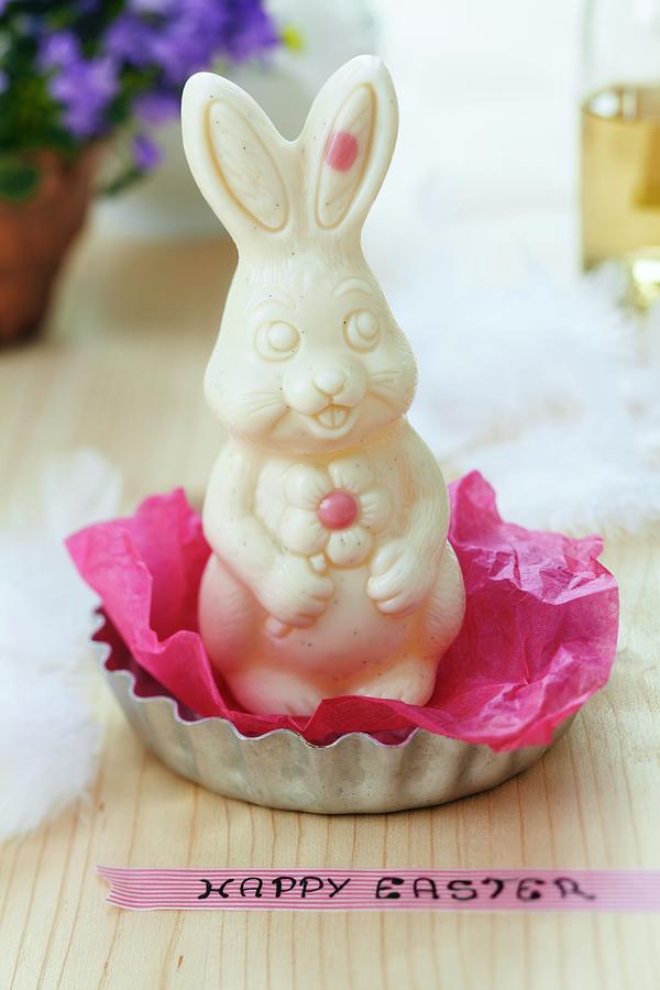White Chocolate Easter Bunny On Tissue Paper In Tartlet Tin And Easter Greeting On Washi Tape Photograph by Franziska Taube