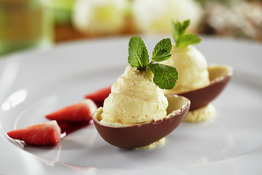 White Chocolate Mousse With Peppermint Served In Chocolate Egg Halves For Easter Photograph by Herbert Lehmann