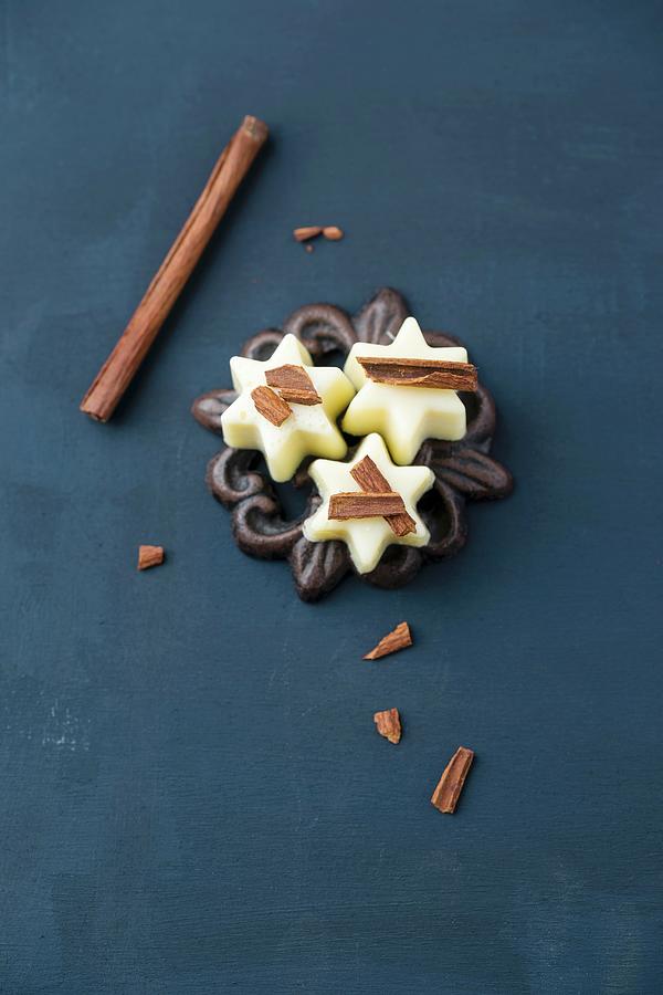 White Chocolate Pralines With Cinnamon Sticks Photograph by Mandy Reschke