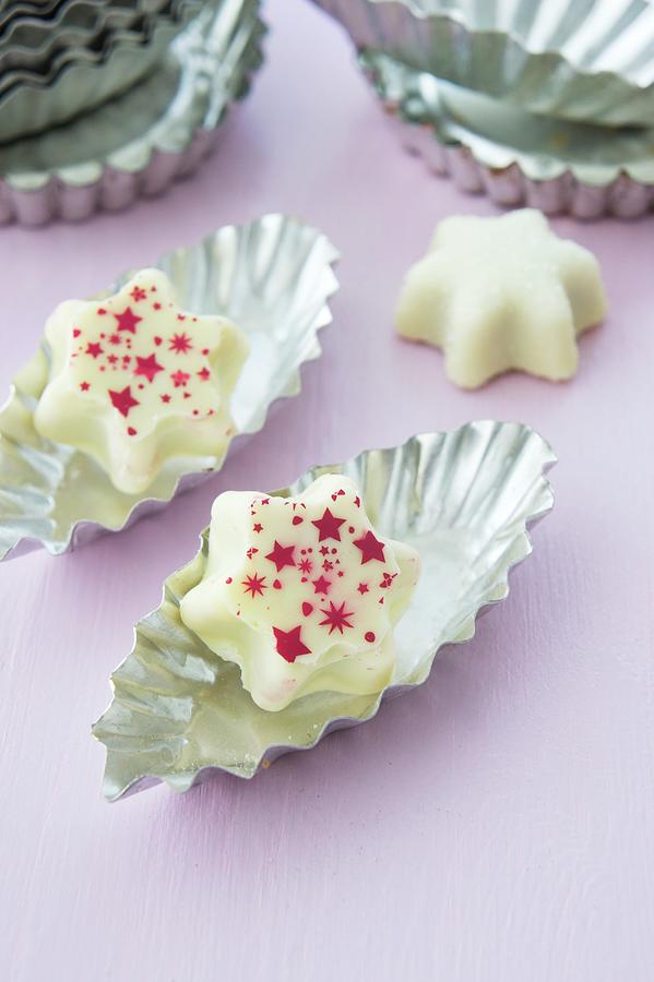 White Chocolate Pralines With Stars Photograph by Martina Schindler
