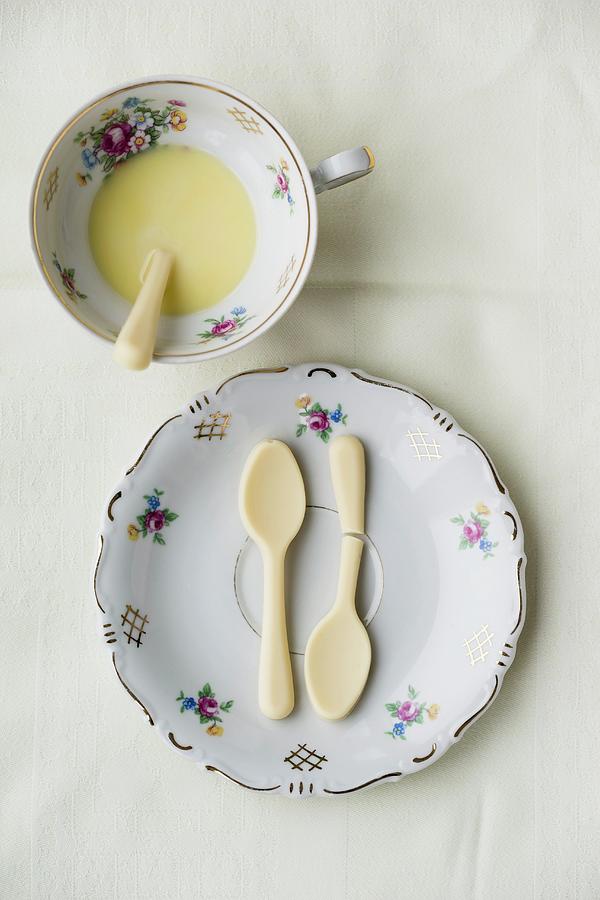 White Chocolate Spoons On A Plate And A Cup Of Hot White Chocolate Photograph by Mandy Reschke