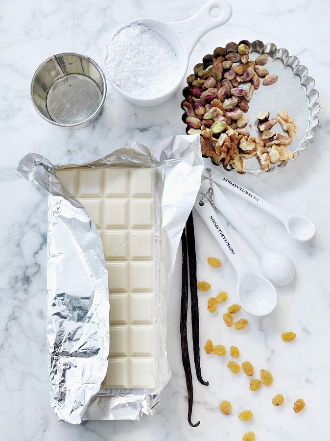 White Chocolate, Vanilla Pods, Raisins, Pistachios And Icing Sugar Photograph by Lina Eriksson