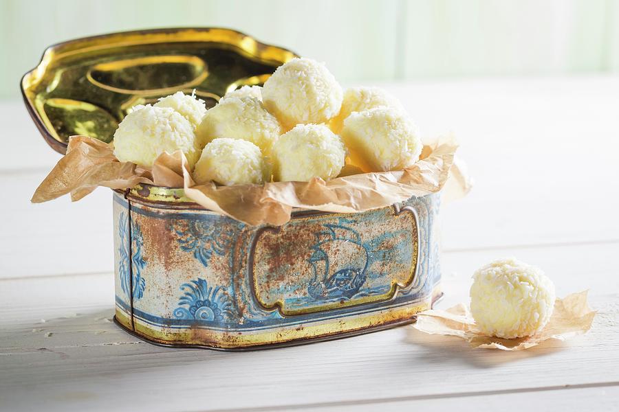 White Coconut Pralines In A Metal Tin Photograph by Shaiith