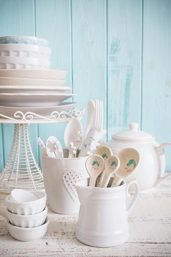 White Crockery And Cutlery Against A Light Blue Wooden Wall Photograph by Maricruz Avalos Flores