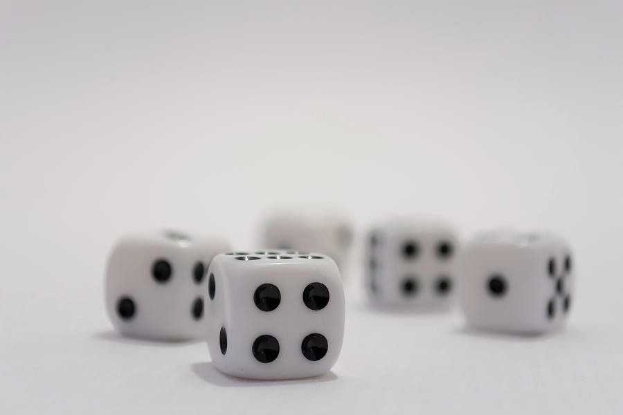 White dice with black dots on white background Photograph by Scott Lyons