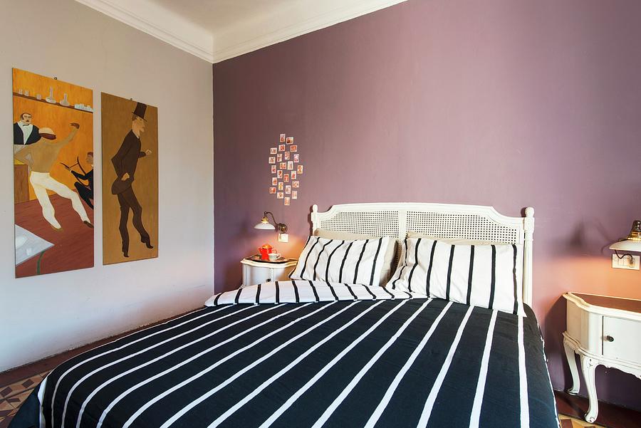 White Double Bed With Black And White Striped Bed Linen Against Mauve Wall Photograph by Andrea Cuscuna