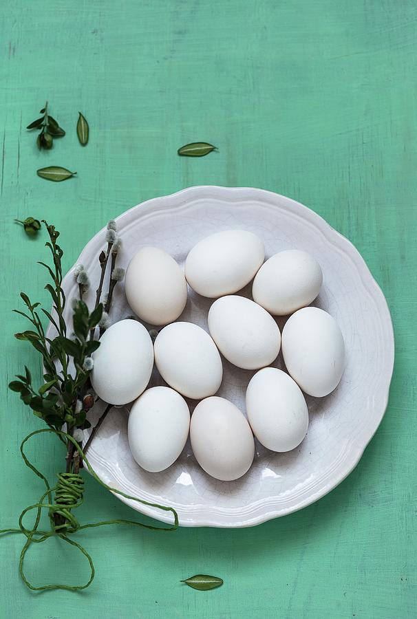 White Eggs On A Plate With Catkins Photograph by Adel Bekefi