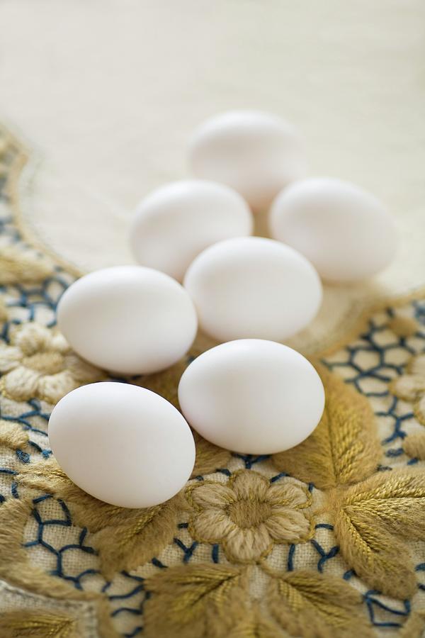 White Eggs On Floral Embroidered Vintage Tablecloth Photograph by Alicja Koll