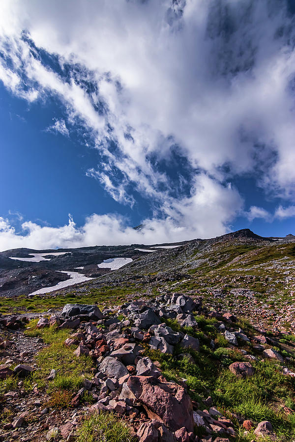 White Fluffy Clouds In A Bright Blue Sky Over A Mountain Landscape Photograph By Taya Johnston