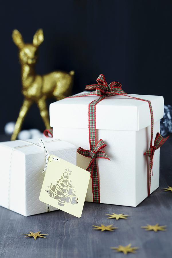 White Gift Boxes With Tartan Ribbon And Gift Tag Photograph by Franziska Taube