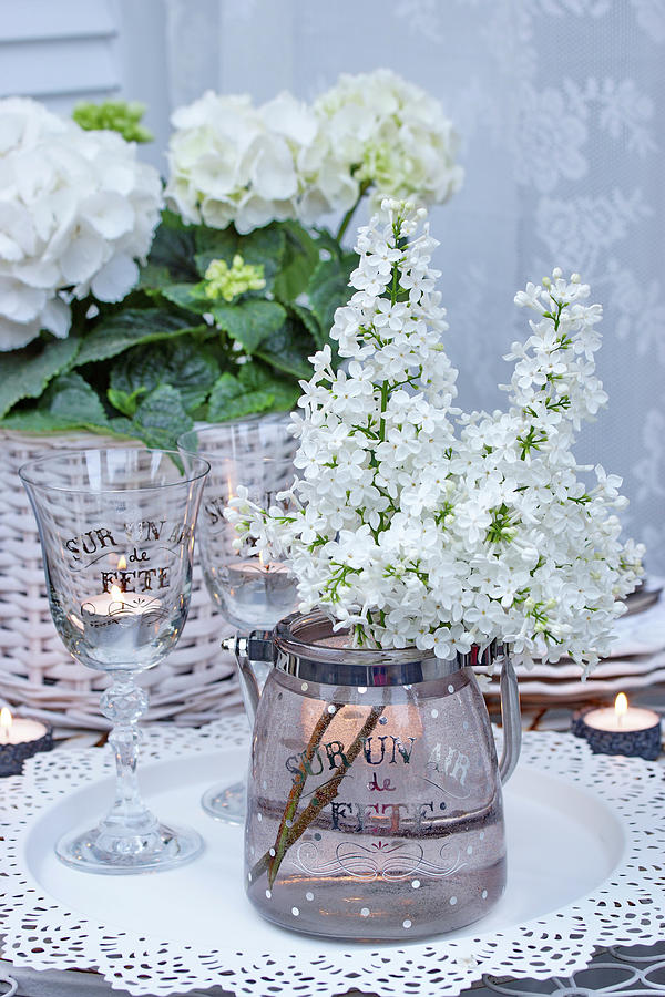 White Lilac Bouquet On The Patio Table In The Winter Garden Photograph by Angelica Linnhoff