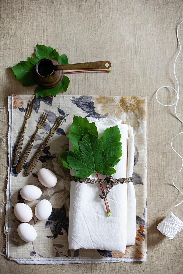 White Linen Napkin, Vine Leaves, White Eggs, Vintage Forks And Mocha Coffee Pot Photograph by Alicja Koll
