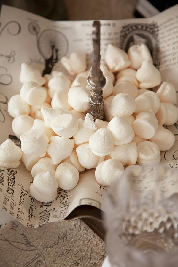 White Meringues On Vintage-style Paper On Cake Stand Photograph by Great Stock!